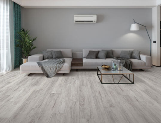 Trendy light grey, nature inspired flooring that uses the most modern flooring technology to provide durability and water resistance can increase your home's value.