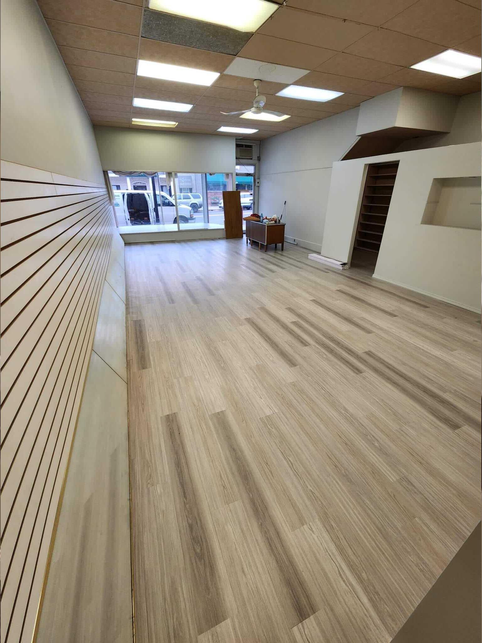 An affordable waterproof flooring option for your small commercial space is a glue down vinyl plank.