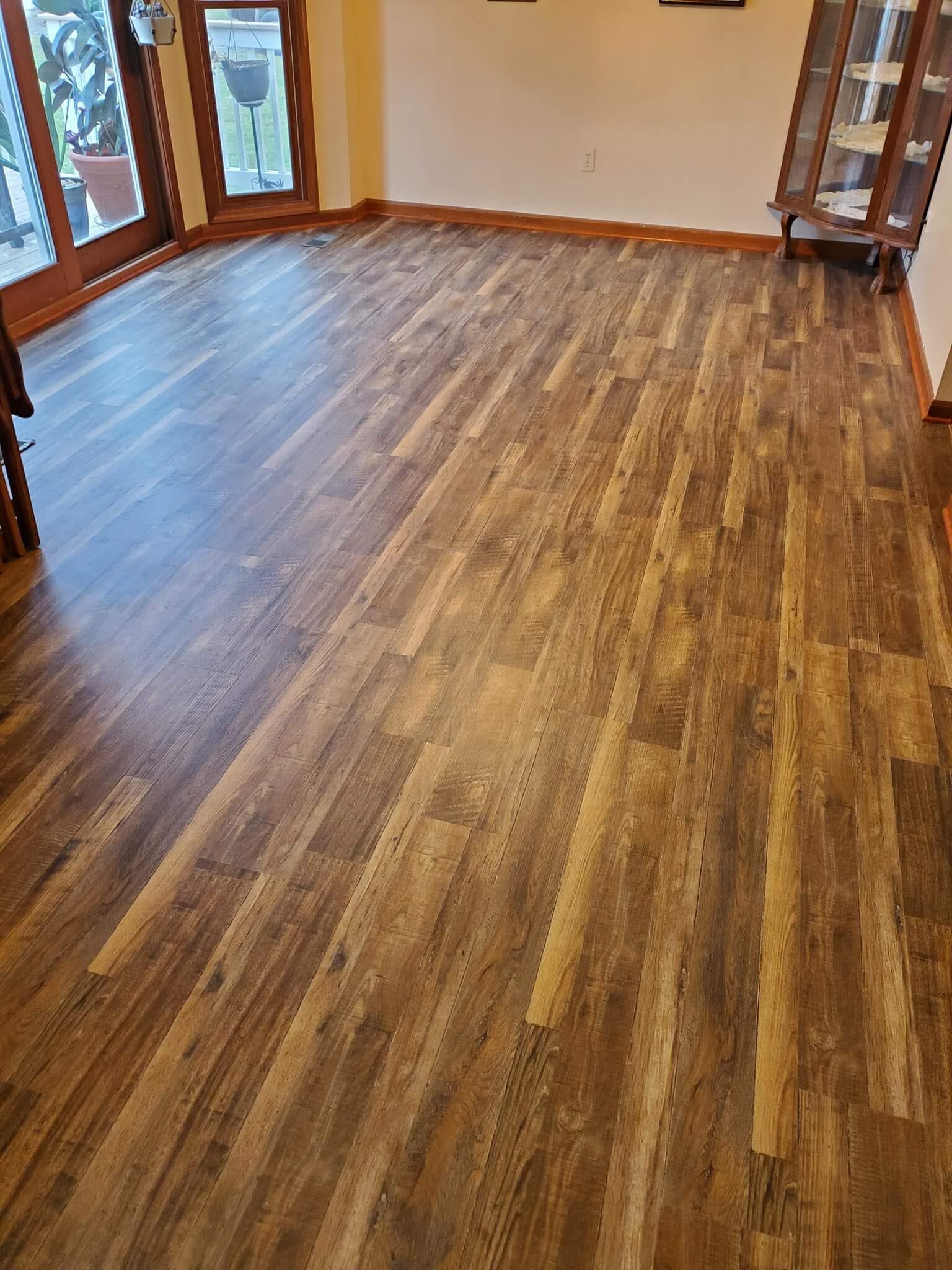 Modern flooring technology meets a traditional hardwood style in this beautiful natural wood look luxury vinyl plank installation.