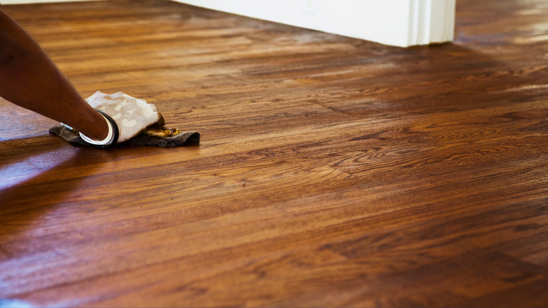 Newly refinished hardwood flooring with dark brown stain